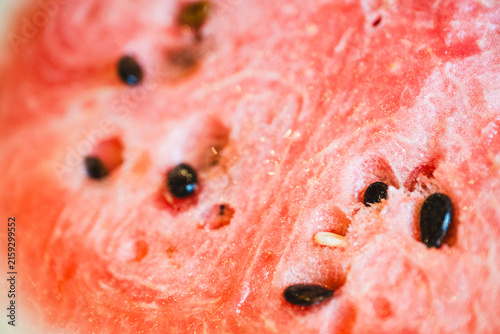 Obraz na plátně macro close-up of ripe, cut watermelon with pink gradient and seeds