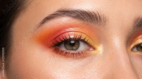Plakat w ramie Glossy Sunset Eyeshadow Makeup on Green Eye Close Up