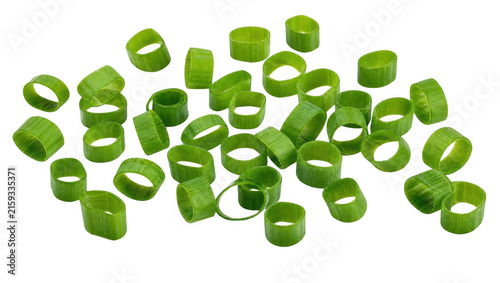 Quadro su tela Chopped green onions scattered in studio lighting for culinary preparation and g