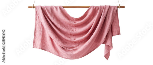 Фотография Rose muslin textile draped over a wooden rod with soft studio lighting