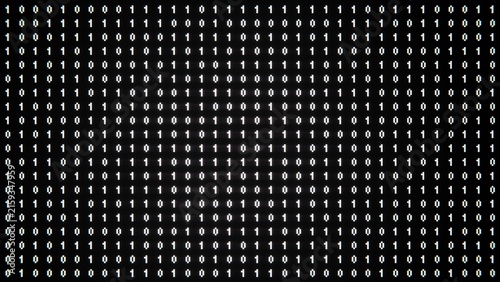 Digital binary code on black background. Matrix style program. Random falling numbers.