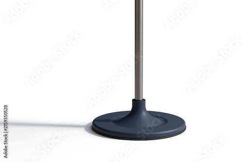 Dark grey floor lamp base with a thin metal pole on a background, with a long shadow