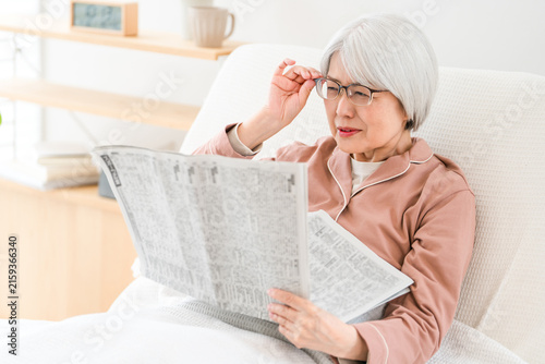 Принти на полотні Senior citizens reading newspapers, elderly women (with presbyopia, unable to re