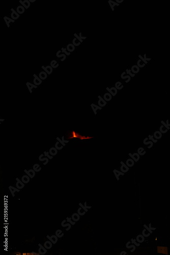 Mt. Etna volcano erupting at night in Sicily Italy