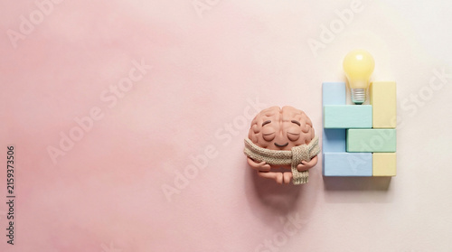 Brain Character Meditating with Lightbulb Blocks for Creative Growth