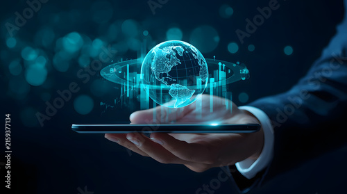 A business professional uses a tablet device to display a futuristic digital hologram interface
