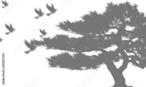 Canvastavla Silhouette of windswept tree with broad canopy and flock of birds flying left in
