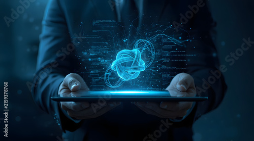 Businessman holding tablet displaying blue holographic data visualization and futuristic interface