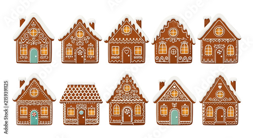 Collection of decorative gingerbread houses with ornate icing and festive detail.