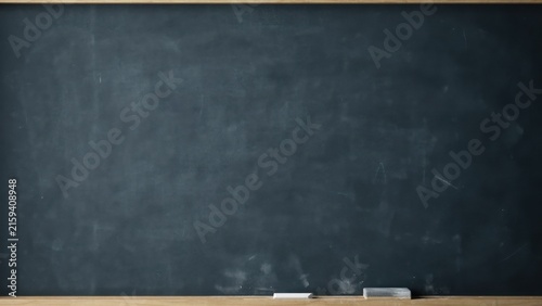 Empty blackboard with chalk and eraser on wooden surface
