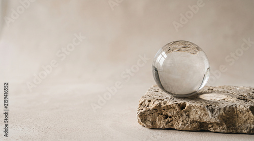 Clear Glass Sphere on Natural Limestone Surface
