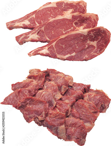 Fresh raw beef steak slices arranged on white plate with rosemary garnish