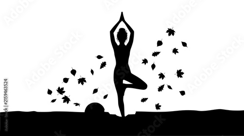 Silhouette of a Woman Practicing Yoga Tree Pose in Autumn