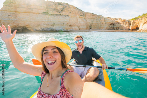 Cuadro en lienzo Young couple enjoying a vibrant kayak adventure in the turquoise waters of the a