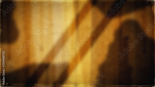 Abstract golden brown background with soft light shadows and organic textured grain patterns.