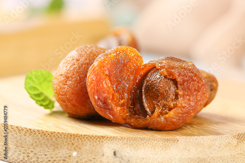 Dried Apricots from Xinjiang China - Sweet Healthy Snack on Wooden Board