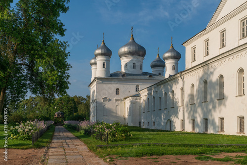 Church of the Nativity of Christ (Spassky Cathedral) of the St. George (Yuriev) Monastery and kivoriy (canopy over the spring of water) on a sunny summer day, Veliky Novgorod, Russia