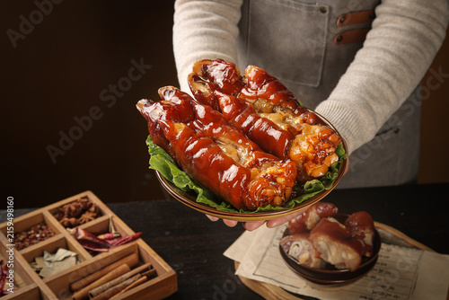 Fotografie Braised Pork Trotters Chinese Gourmet Dish Chef Presenting Traditional Marinated