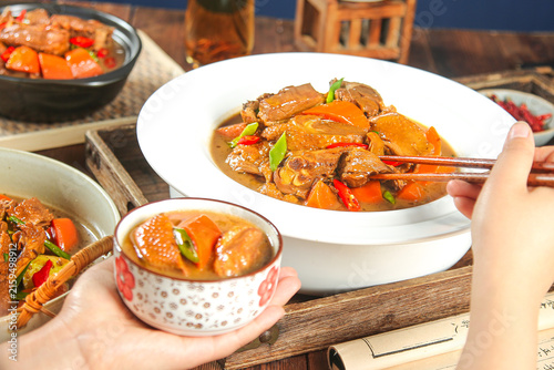 Bild auf Leinwand Traditional Braised Goose Stew with Potatoes and Vegetables in Rustic Country St