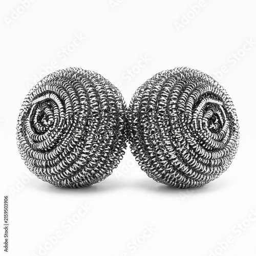 Two steel wool scrubbing balls sit side-by-side on a white surface, ready for cleaning. 
