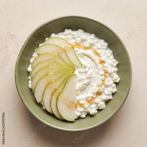 Fresh Sliced Pear With Cottage Cheese And Honey In Green Bowl
