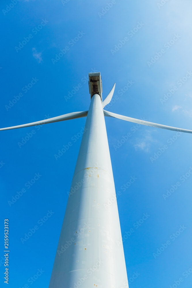 Naklejka premium Low Angle Wind Turbine Against Clear Blue Sky