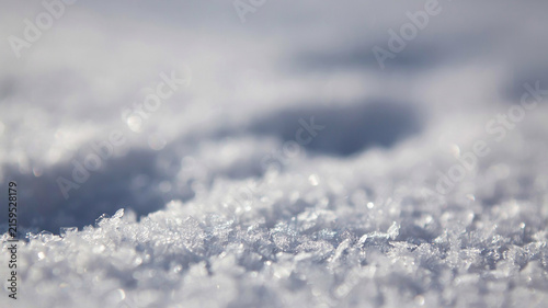 Blurred snow crystals with a dark indentation a winter scene