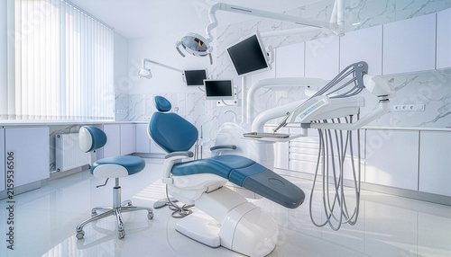 Empty modern dental clinic room with blue dentist chair overhead lamp medical equipment monitors bright clean oral care center modern healthcare facility design interior view