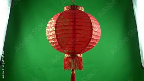 Traditional Chinese Red Lantern Hanging on Green Screen Background for Lunar New Year