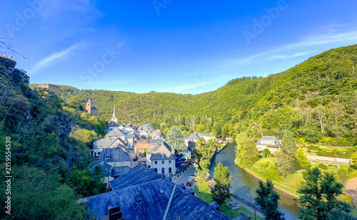 Esch-sur-Sure, Wiltz, Grand-Duche de Luxembourg, September 07, 2025, Hillside panorama of historic village with river curve and clustered rooftops, lush forests on surrounding ridges, sweeping