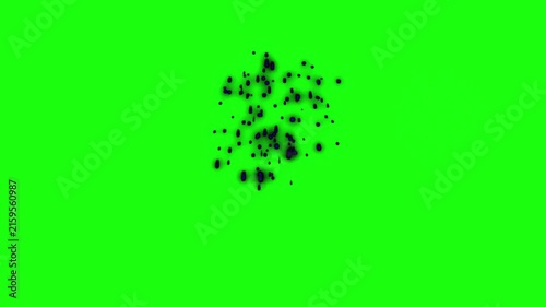 Black smoke burst explodes dynamically in the center of a bright green chroma key background for editing.