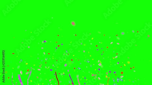 Colorful confetti and festive streamers bursting upward against a bright green chroma key background.