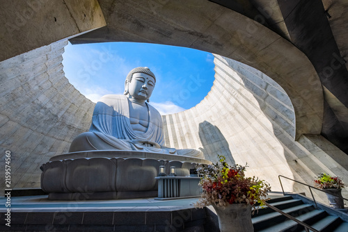 Sapporo, Japan - October 30 2025: Makomanai Takino Cemetery is a vast greenspace features a collection of 40 Moai head, a Stonehenge replica and a giant Buddha statue.