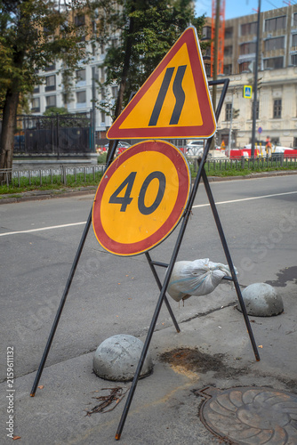 Road signs near the construction site on a summer day