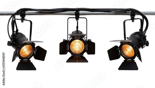 Three Stage Spotlights Illuminated on a White Background.