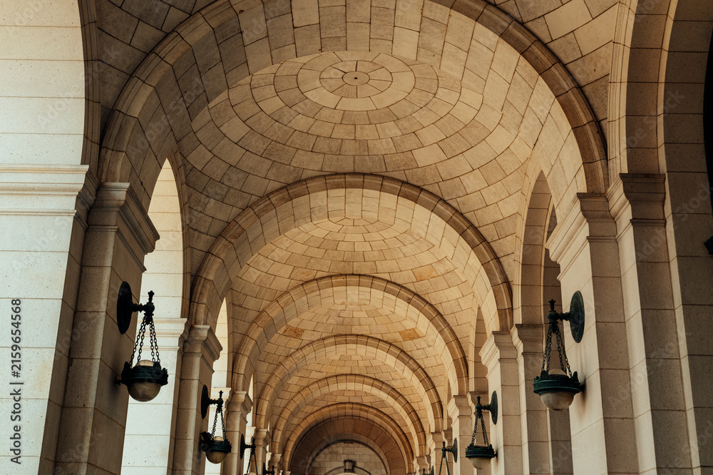 Fototapeta premium Stone arches create geometric patterns in historic architecture.