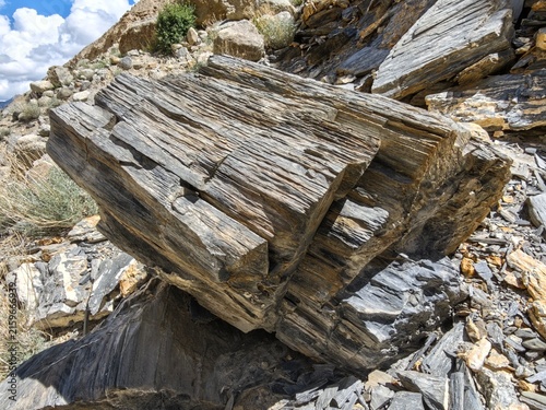 Layered metamorphic rock with pronounced foliation and weathered texture in the mountains of Ladakh, India
