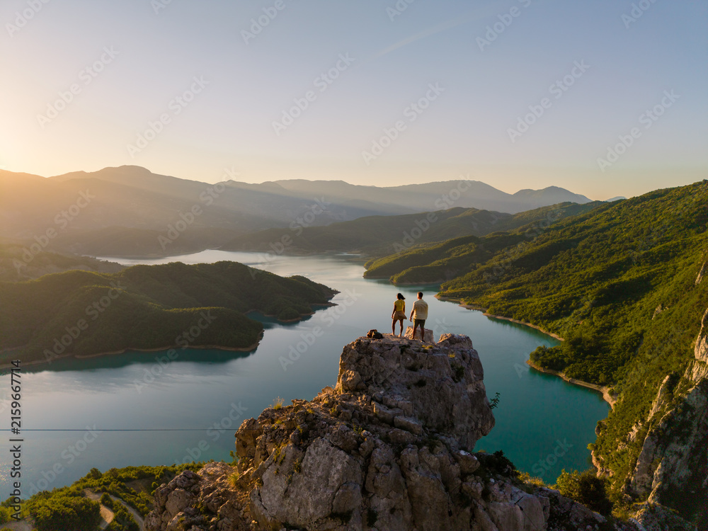 Fototapeta premium Stunning sunset views at Bovilla Reservoir in Albania, surrounded by breathtaking nature