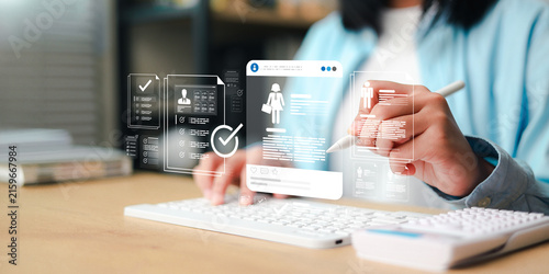 Recruitment and human resources concept showing a professional reviewing digital employee profiles, hiring documents,