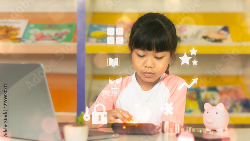 Asian girl using calculator for math learning and financial literacy with digital overlay icons