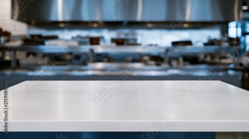 Empty stainless steel prep bench with a cool metallic finish in a blurred restaurant kitchen, featuring copy space for a product mockup
