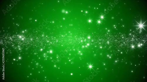 A dynamic background of shimmering green lights and sparkling stars.