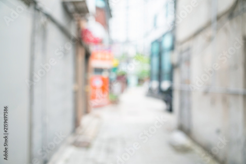 Фотография Abstract blurred old urban residential alley background with local store signs