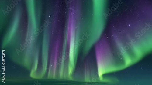 The Aurora Borealis illuminates the night sky with vibrant green and purple hues.