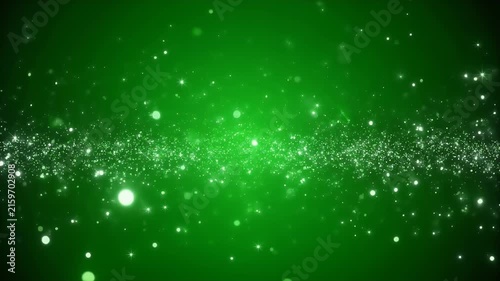 A vibrant green background with a scattering of glowing white particles and stars.