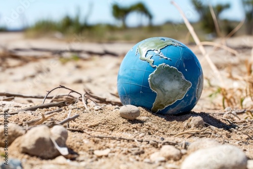 Abandoned and Broken Globe Amongst Waste: Symbol of Planet's Mistreatment and Pollution