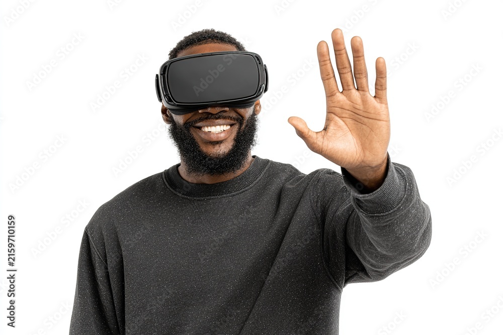 Naklejka premium Man wearing VR headset waving hand