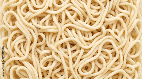 Cooked Wavy Wheat Noodles Flowing Into a Springy Textured Field