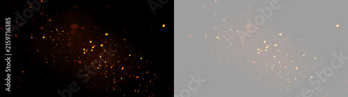 Glowing fire sparks and embers overlay. Isolated orange particles on black and transparent background. Realistic burning dust effect for design