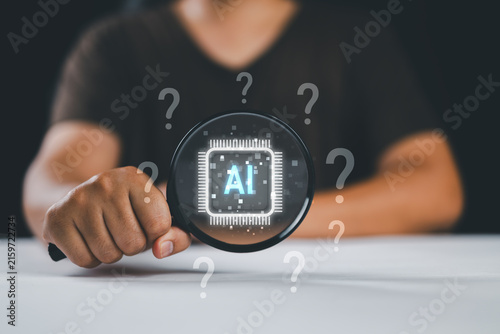 AI question analysis and artificial intelligence research concept. Person using laptop with magnifying glass, AI chip and question marks showing data discovery, problem solving, smart decision support